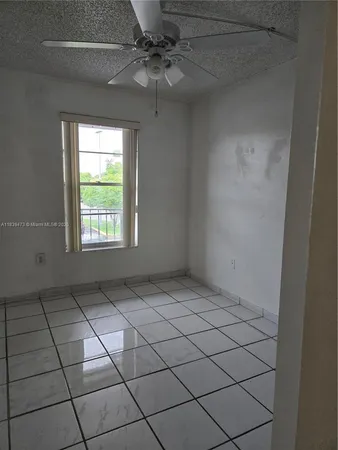 an empty room and window