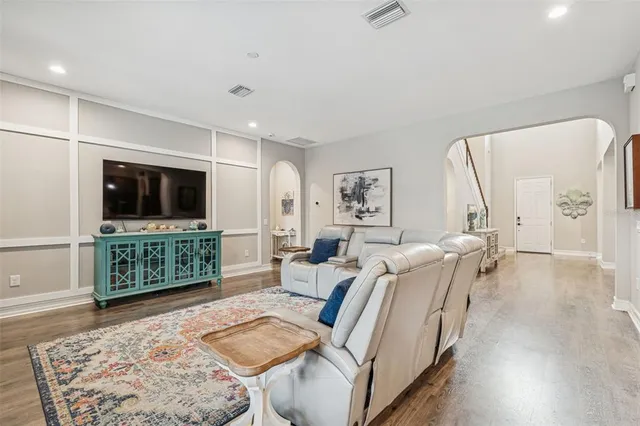 a bathroom with a granite countertop sink a large mirror and vanity