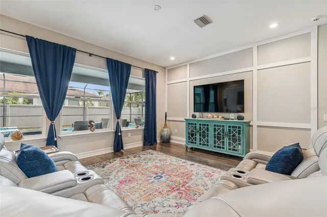 a bathroom with a granite countertop sink a large mirror and shower