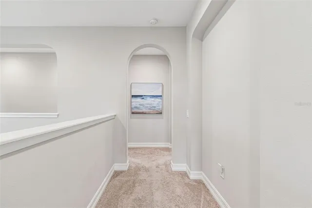 a bathroom with a granite countertop sink mirror vanity and toilet