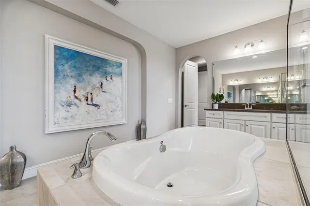 a view of an empty room and a ceiling fan