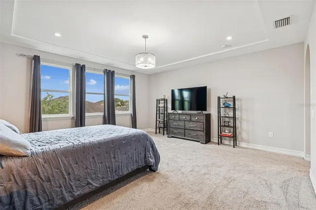 a view of a house with a small deck