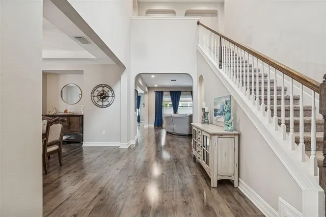 a view of a workspace with furniture and chandelier