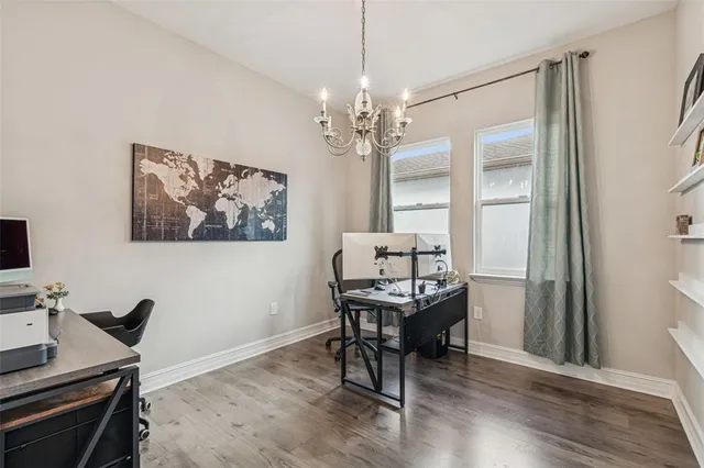 a view of kitchen with furniture and wooden floor