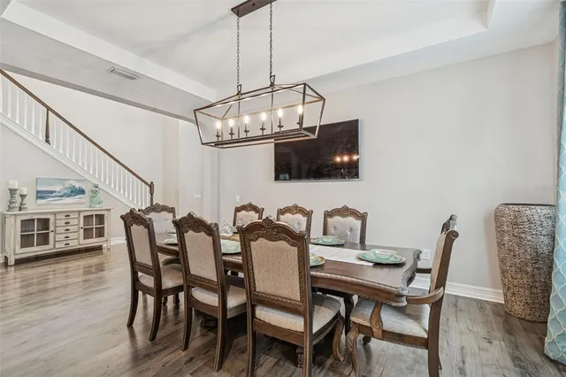 a kitchen with lots of counter top space a sink appliances and cabinets