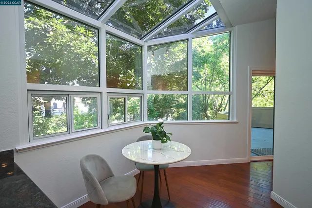 a view of a room with furniture and windows