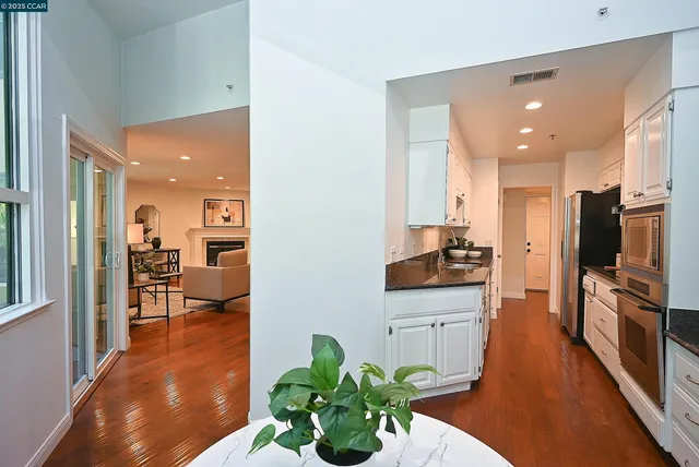 a lobby with furniture and a potted plant