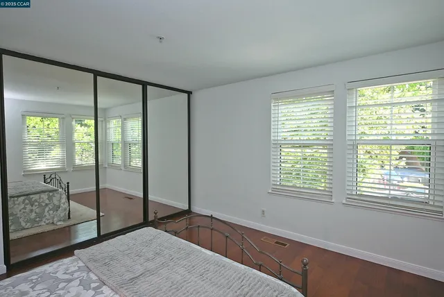 a spacious bedroom with a large window
