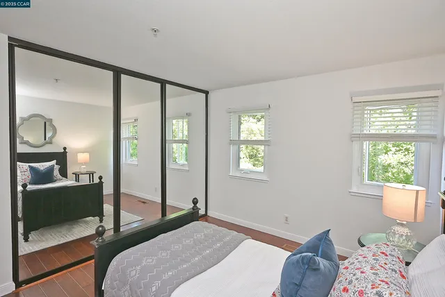 an empty room with windows and closet