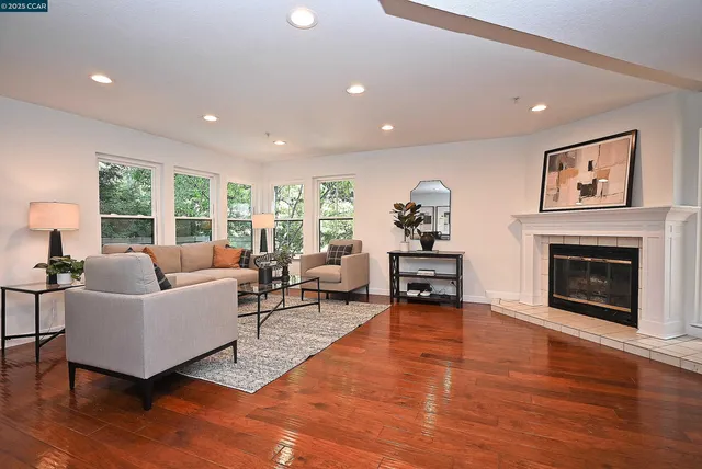 a living room with furniture and a fireplace