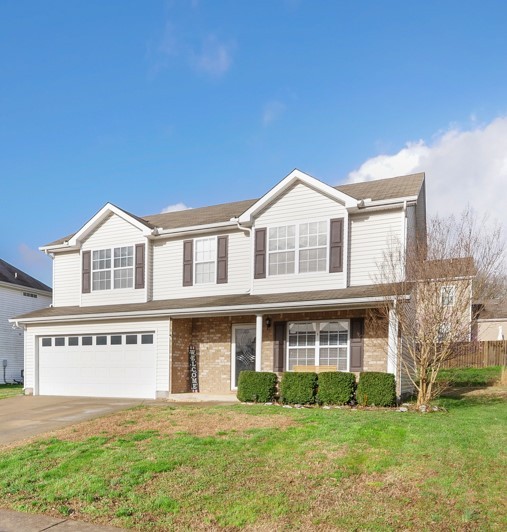 1080 Woodall Road Lebanon, TN 37090 - Photo 1 of 24 a front view of a house with a yard
