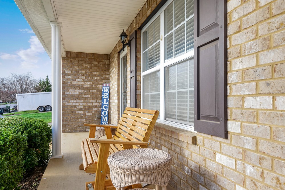 1080 Woodall Road Lebanon, TN 37090 - Photo 2 of 24 a balcony view with a couch and table chair