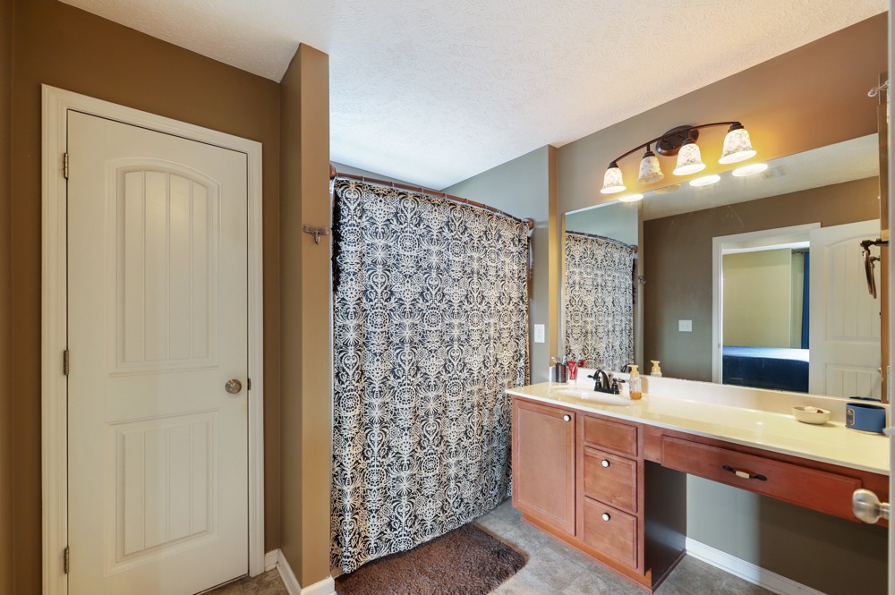 1080 Woodall Road Lebanon, TN 37090 - Photo 15 of 24 a bathroom with a double vanity sink and a mirror