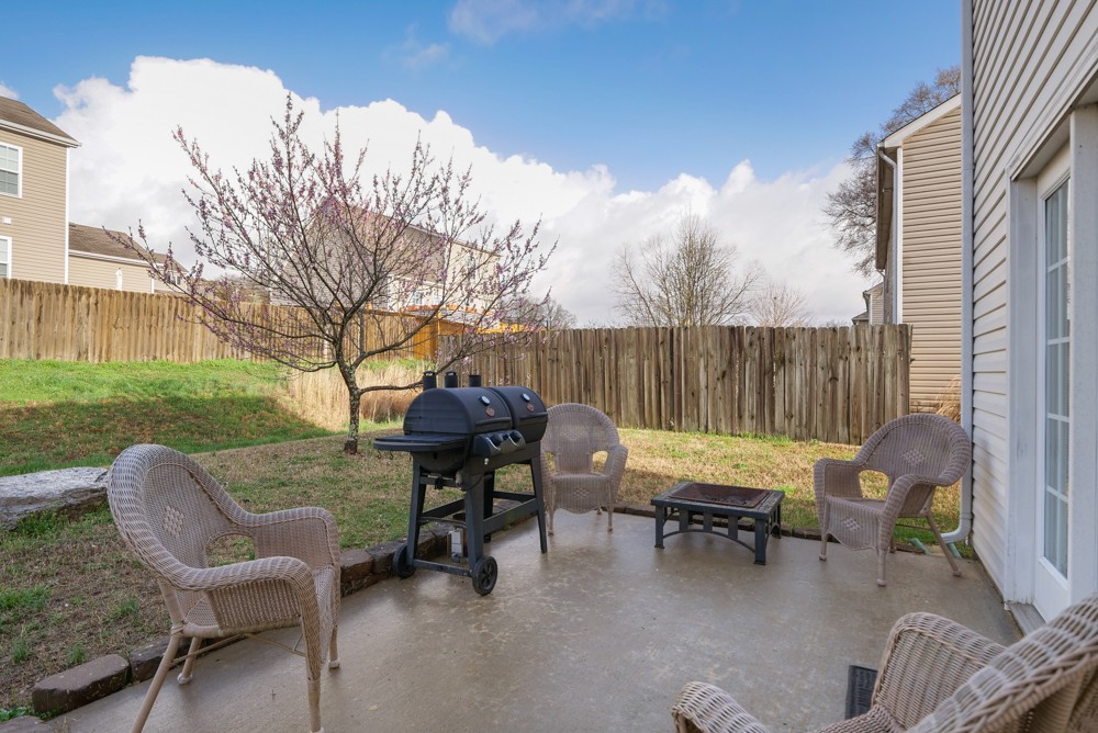 1080 Woodall Road Lebanon, TN 37090 - Photo 19 of 24 a view of a lounge chairs in back yard of the house
