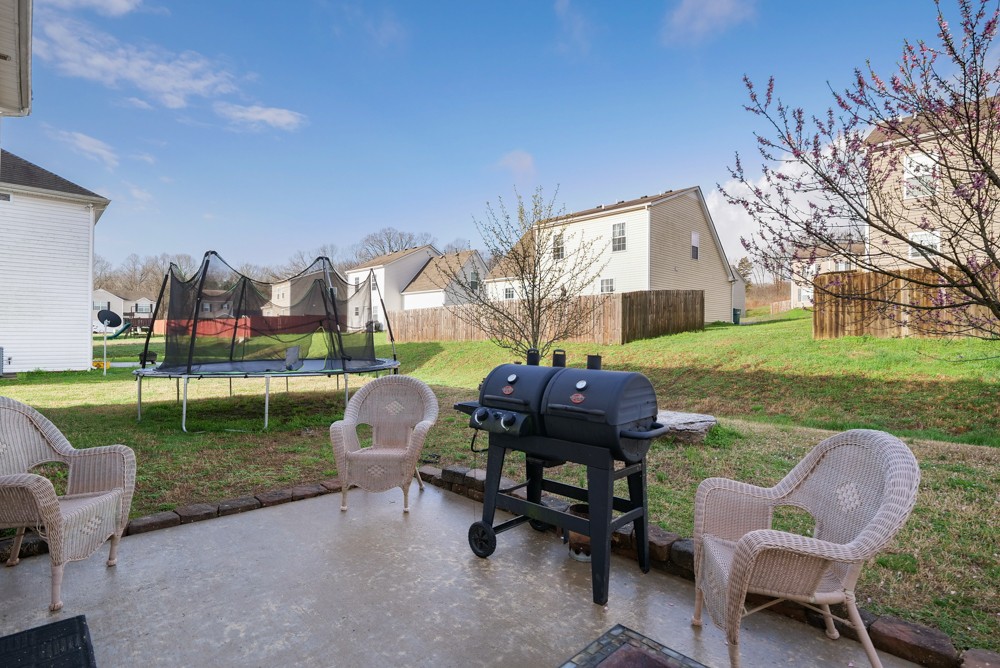1080 Woodall Road Lebanon, TN 37090 - Photo 20 of 24 a backyard of a house with table and chairs
