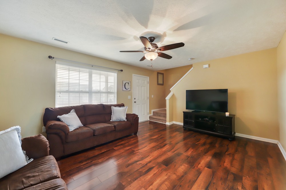 1080 Woodall Road Lebanon, TN 37090 - Photo 4 of 24 a living room with furniture and a flat screen tv