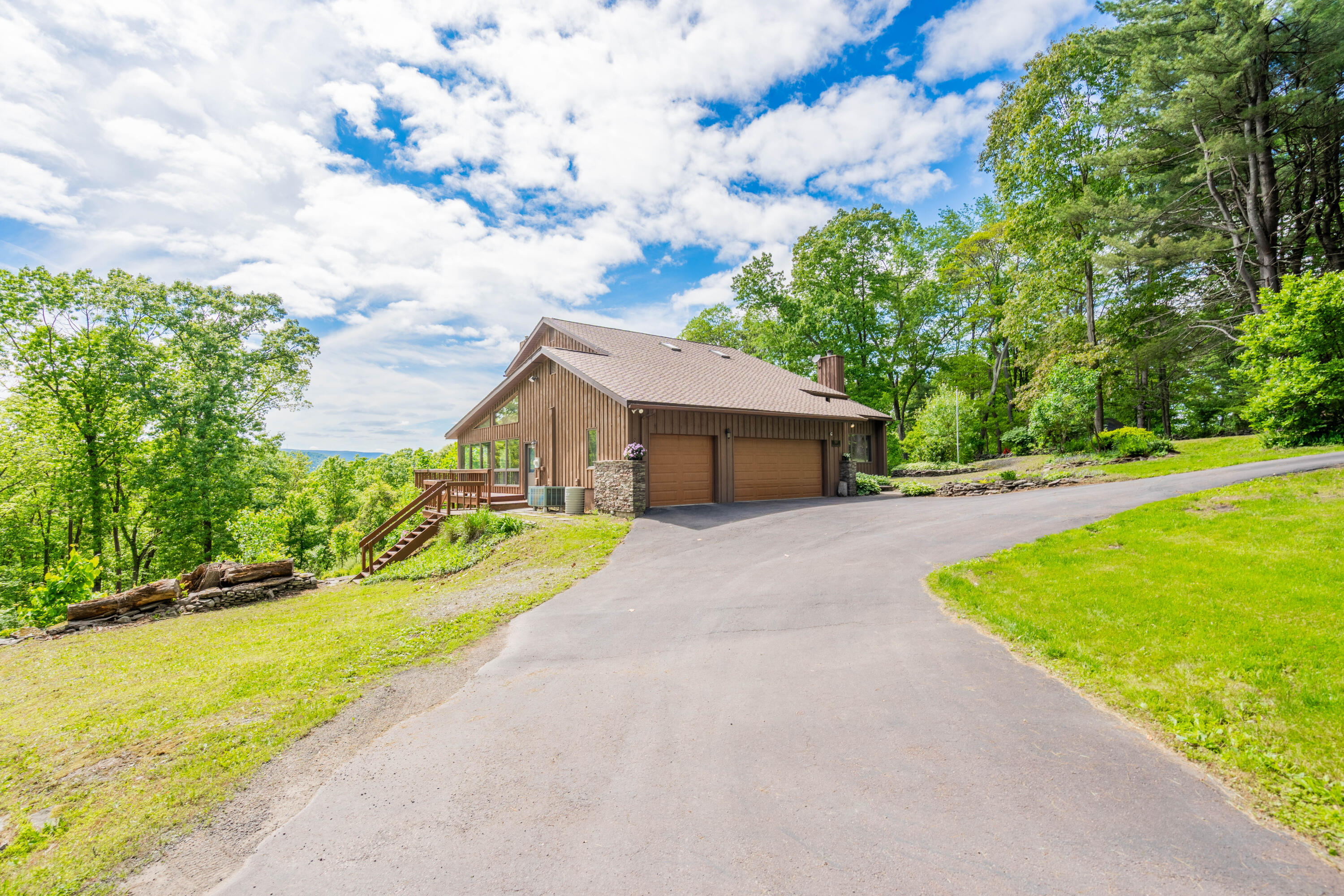 507 Shadowbrook Drive Tunkhannock, PA 18657 - Photo 12 of 57 a front view of house with yard and green space