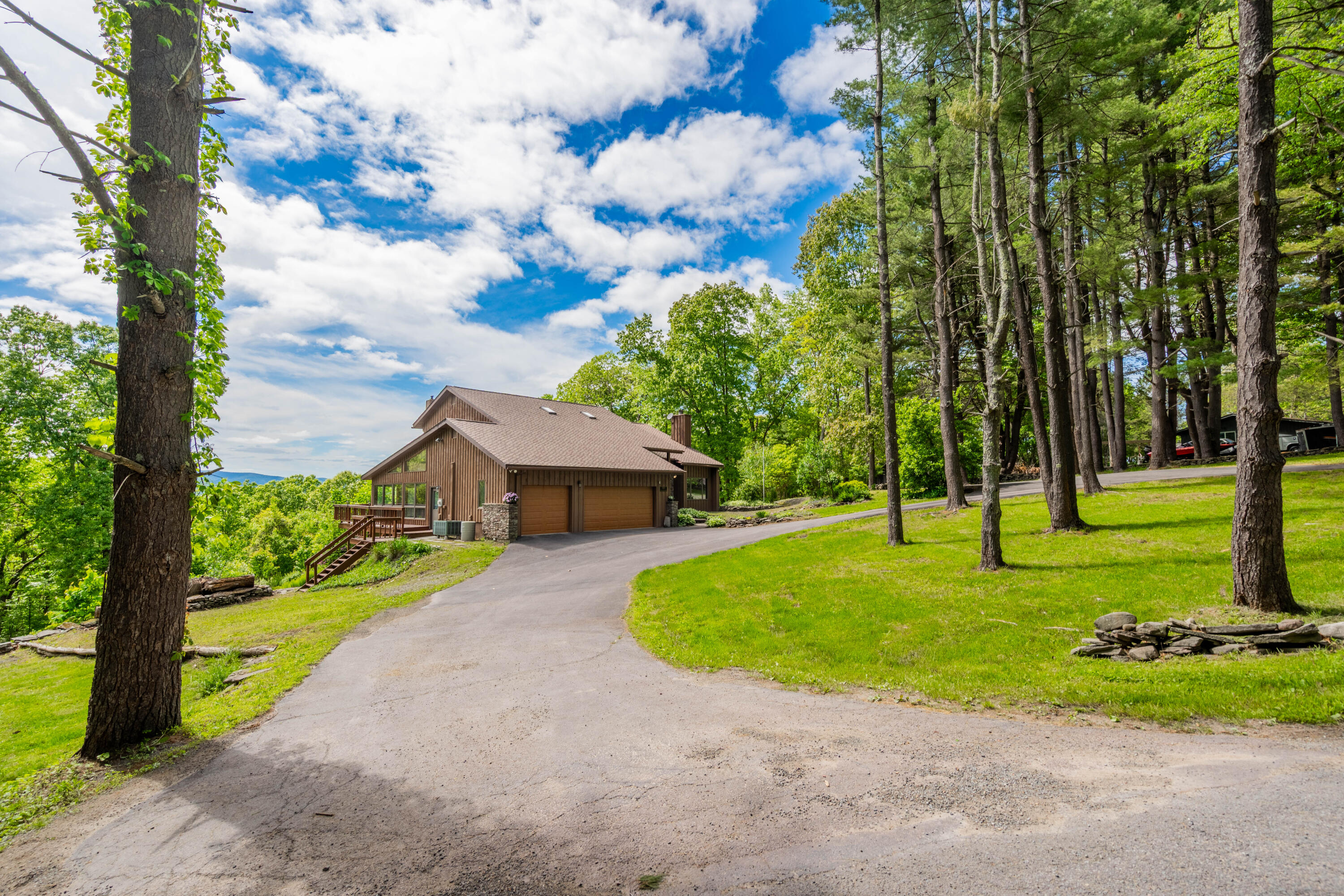 507 Shadowbrook Drive Tunkhannock, PA 18657 - Photo 2 of 57 a view of a house with a big yard plants and large trees