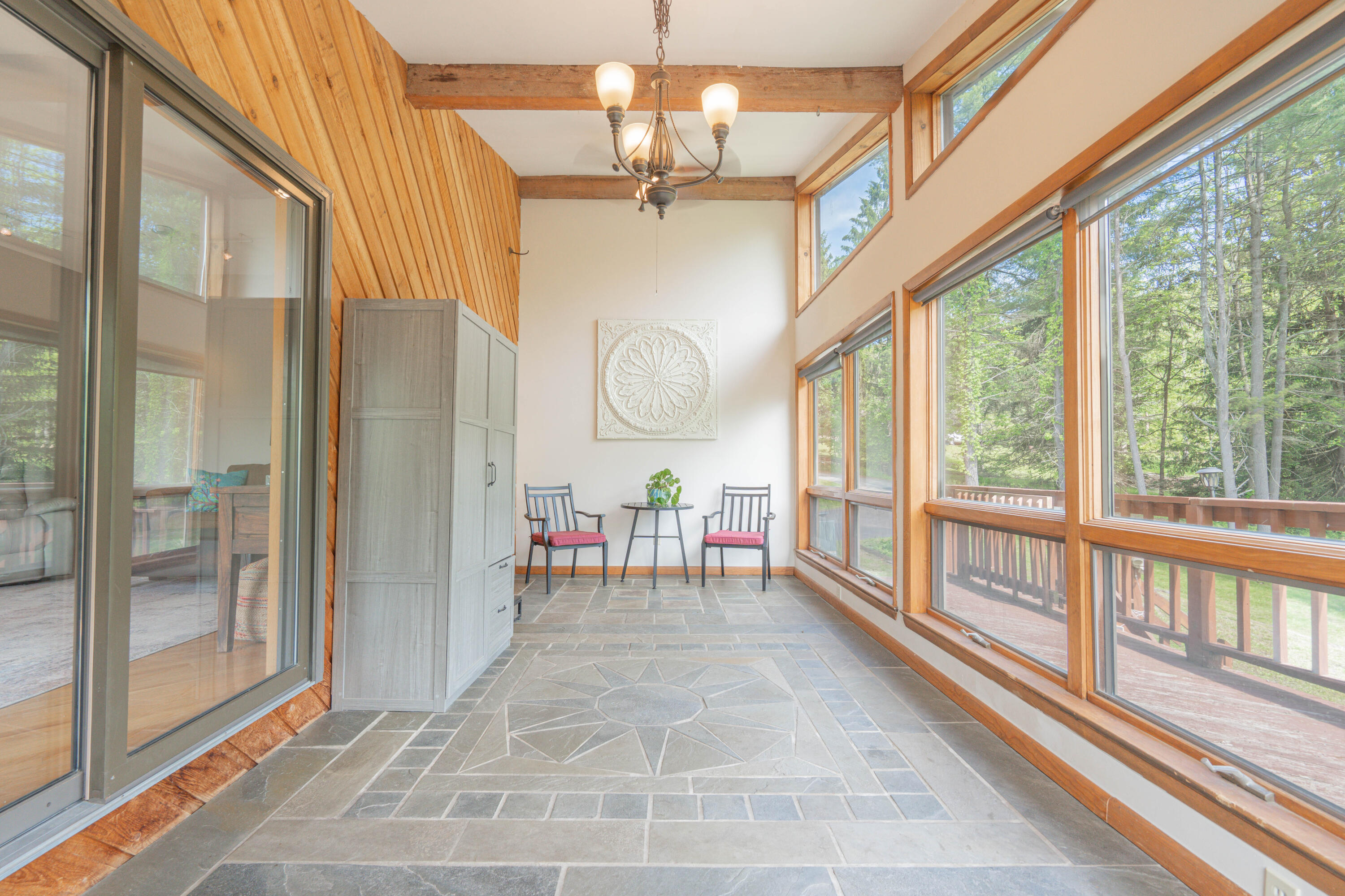 507 Shadowbrook Drive Tunkhannock, PA 18657 - Photo 24 of 57 a view of a porch with a table and chairs