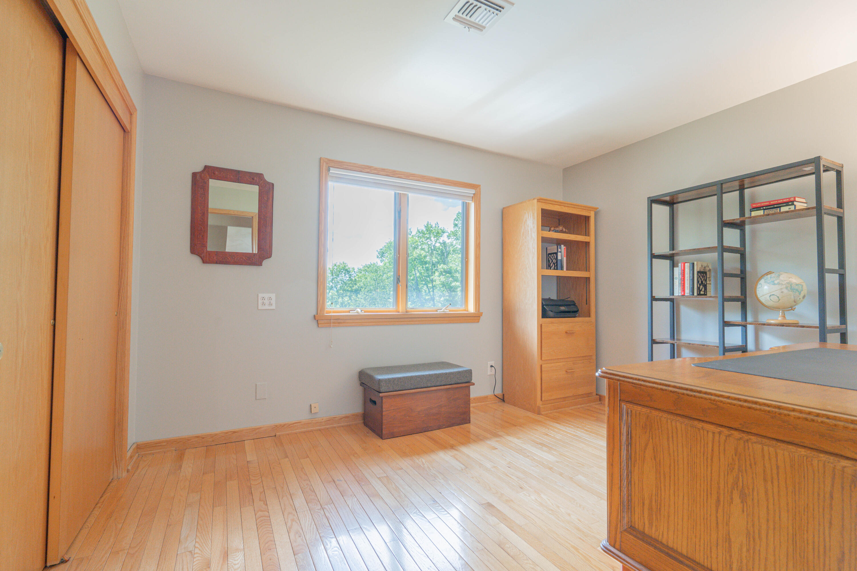 507 Shadowbrook Drive Tunkhannock, PA 18657 - Photo 37 of 57 a bedroom with a bed and a dresser with wooden floor