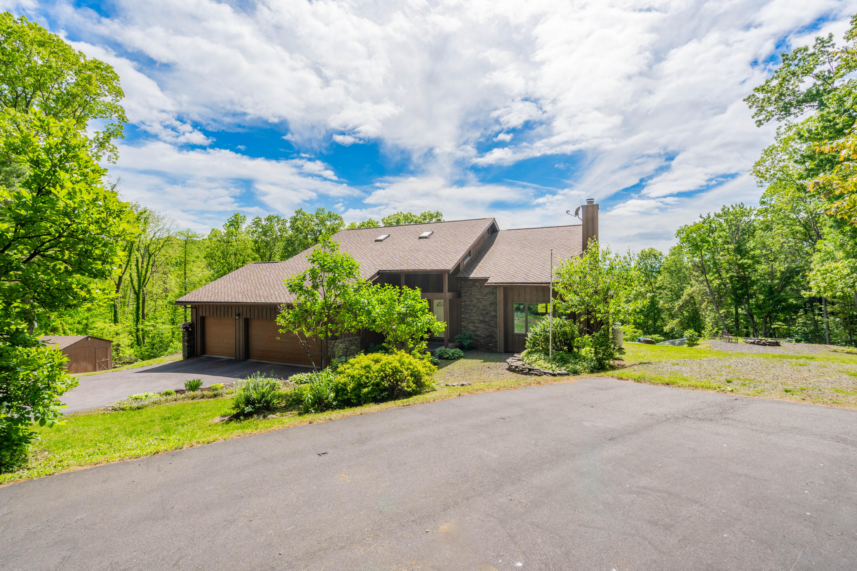 507 Shadowbrook Drive Tunkhannock, PA 18657 - Photo 49 of 57 a front view of a house with garden