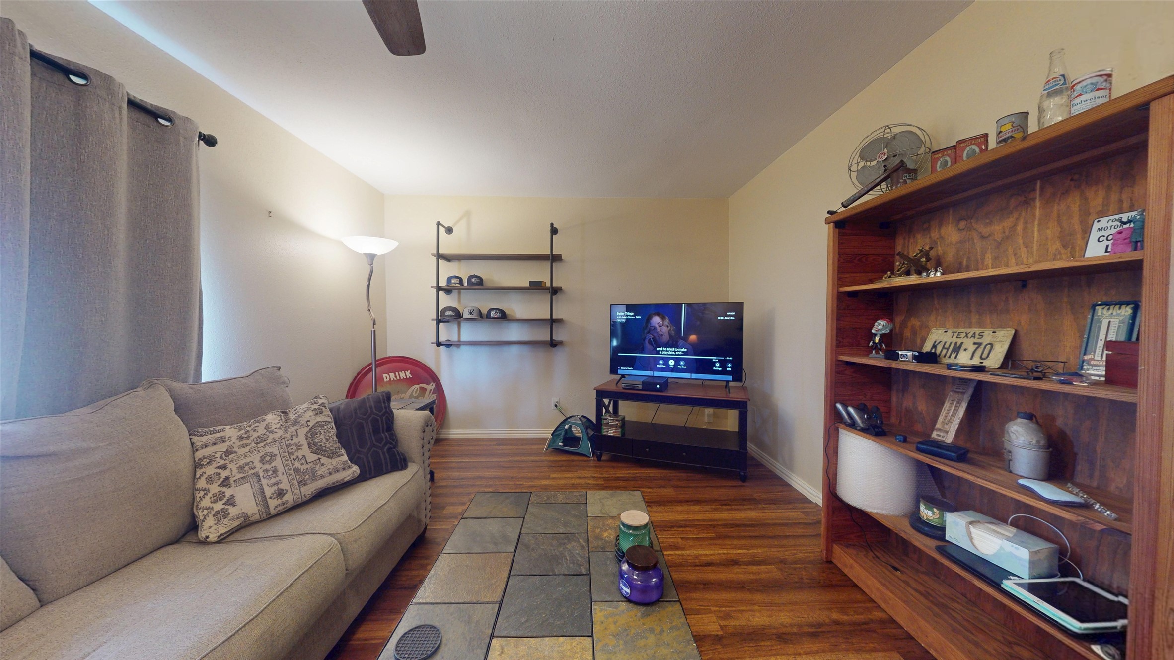 4713 Pine Street Pasadena, TX 77586 - Photo 12 of 38 a living room with furniture and a book shelf