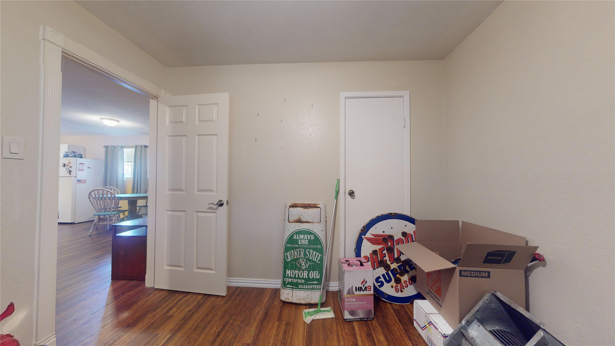 4713 Pine Street Pasadena, TX 77586 - Photo 22 of 38 a view of a workspace with wooden floor and bathroom view