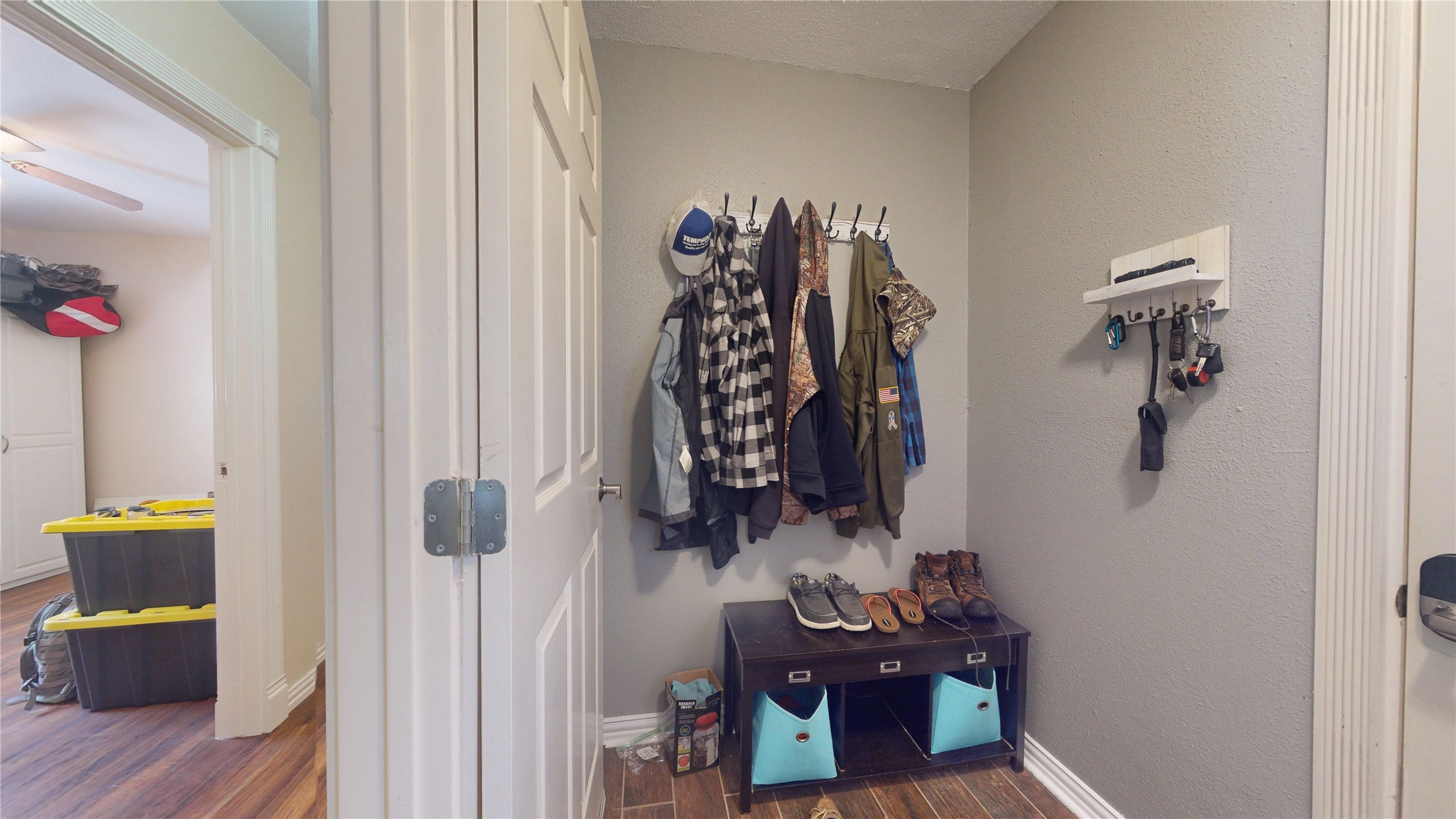 4713 Pine Street Pasadena, TX 77586 - Photo 27 of 38 a view of walk in closet with clothes and shoes