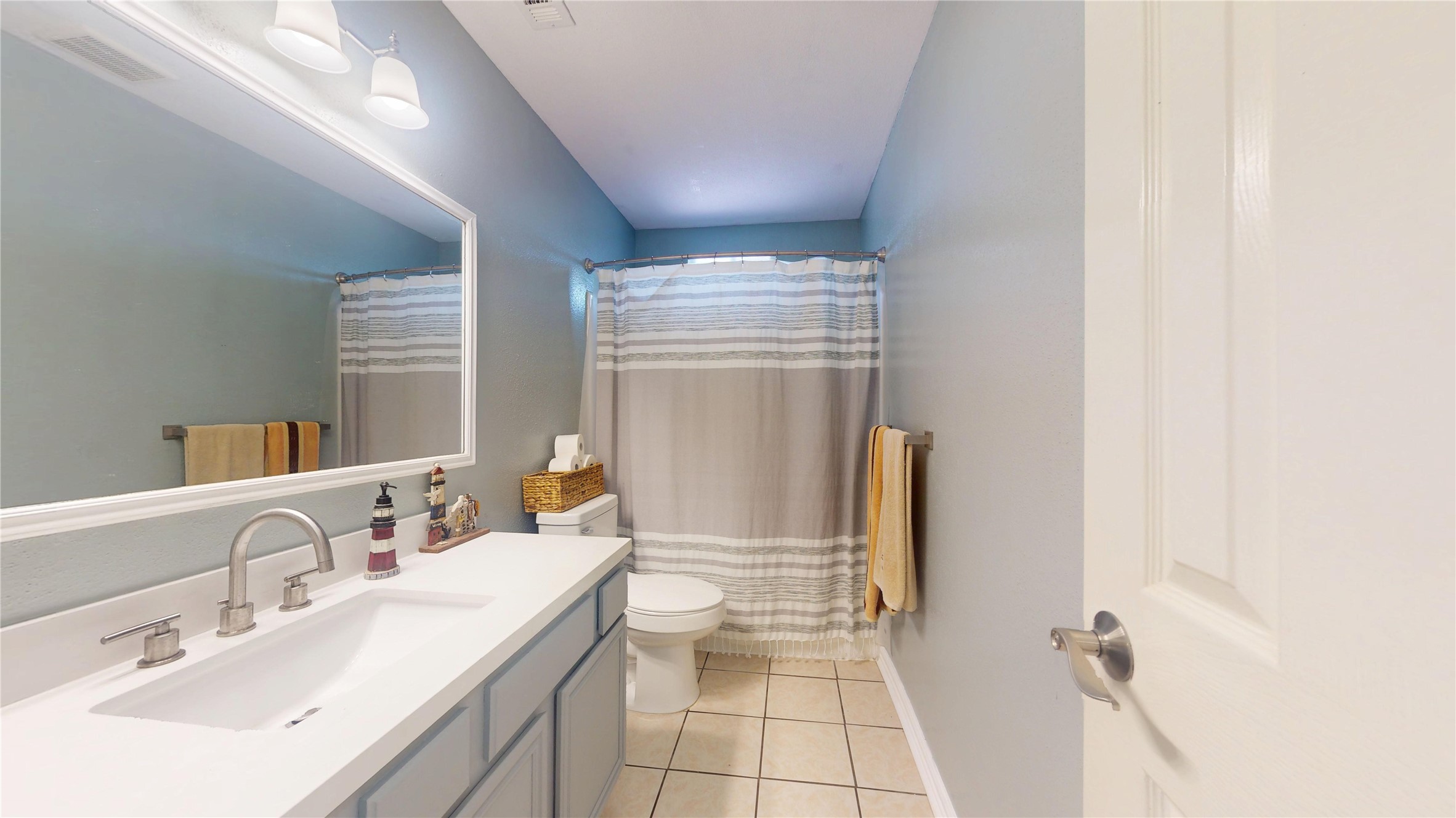 4713 Pine Street Pasadena, TX 77586 - Photo 28 of 38 a bathroom with a double vanity sink toilet and shower