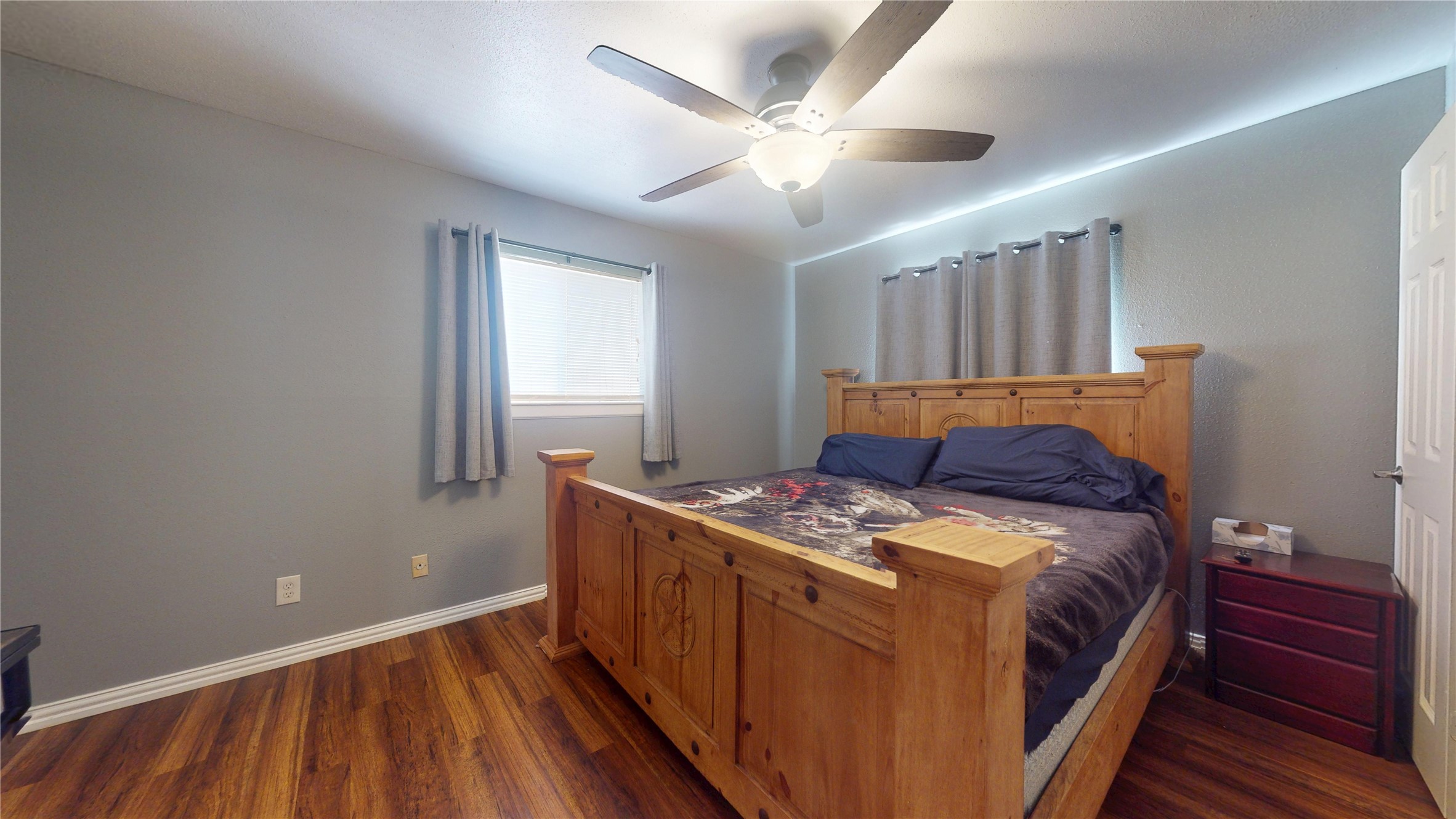 4713 Pine Street Pasadena, TX 77586 - Photo 30 of 38 a bed sitting in a bedroom next to a window