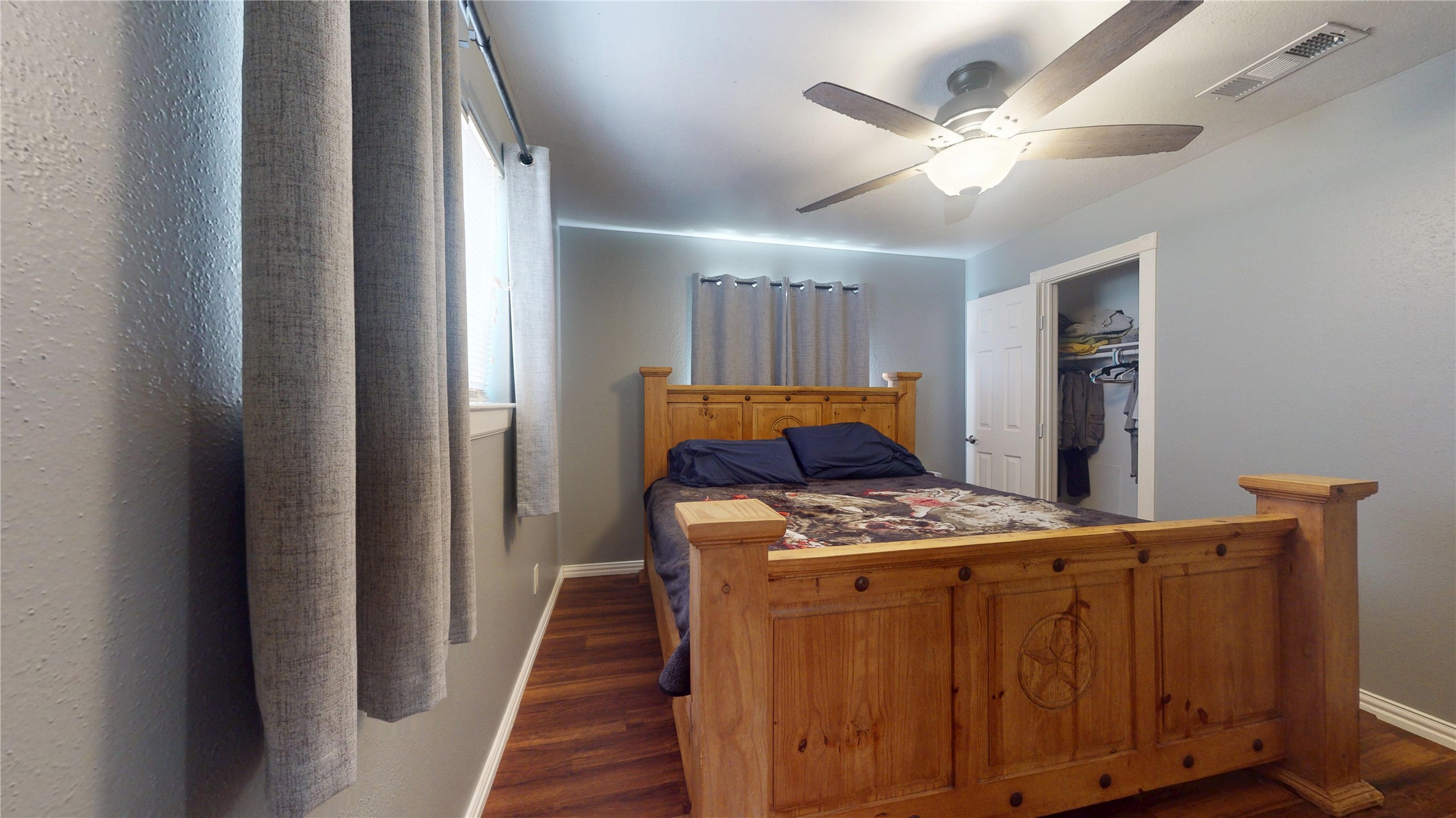 4713 Pine Street Pasadena, TX 77586 - Photo 31 of 38 a bedroom with bed and wooden floor