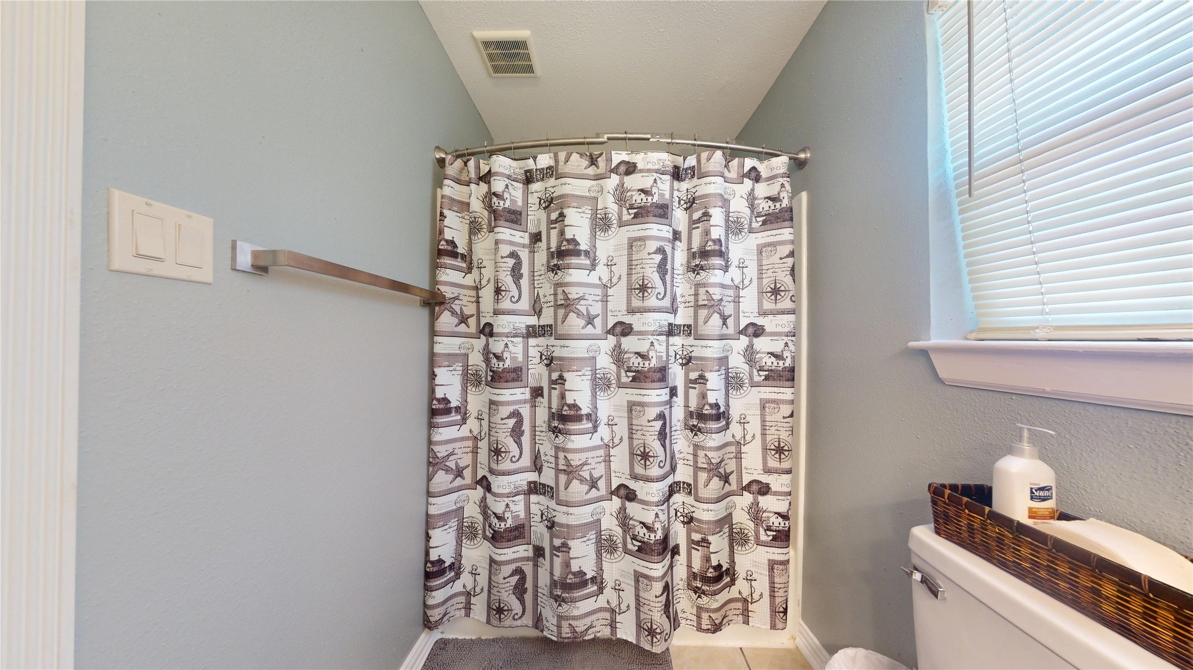 4713 Pine Street Pasadena, TX 77586 - Photo 33 of 38 a bathroom with a shower and a toilet