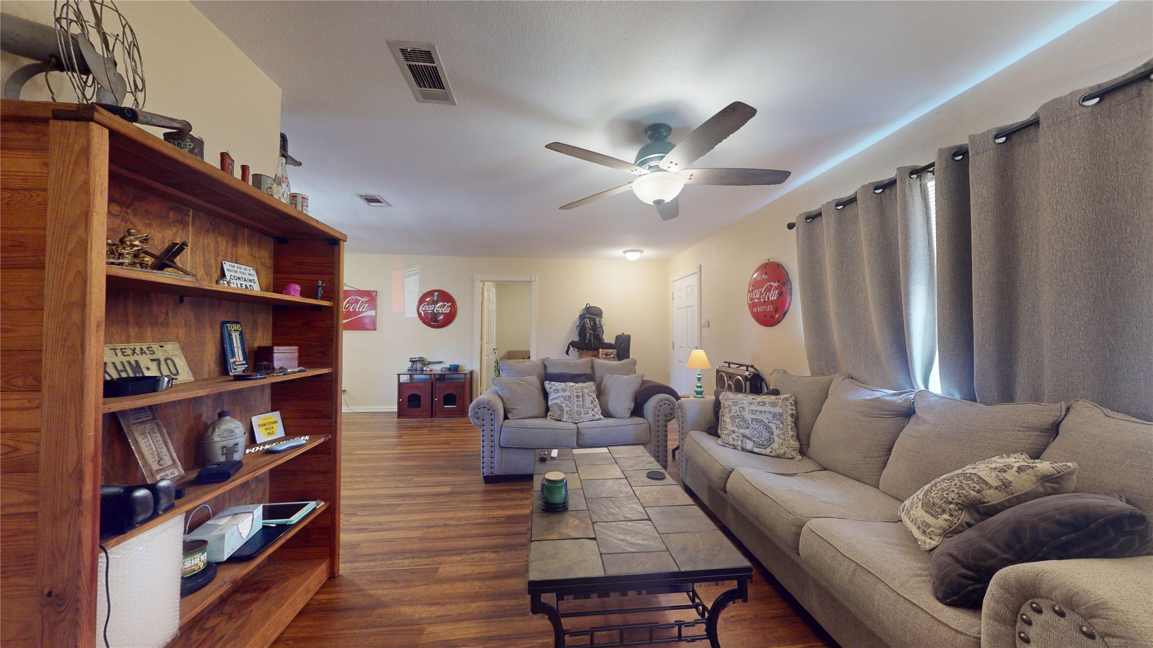 4713 Pine Street Pasadena, TX 77586 - Photo 10 of 38 a living room with furniture and a bookshelf