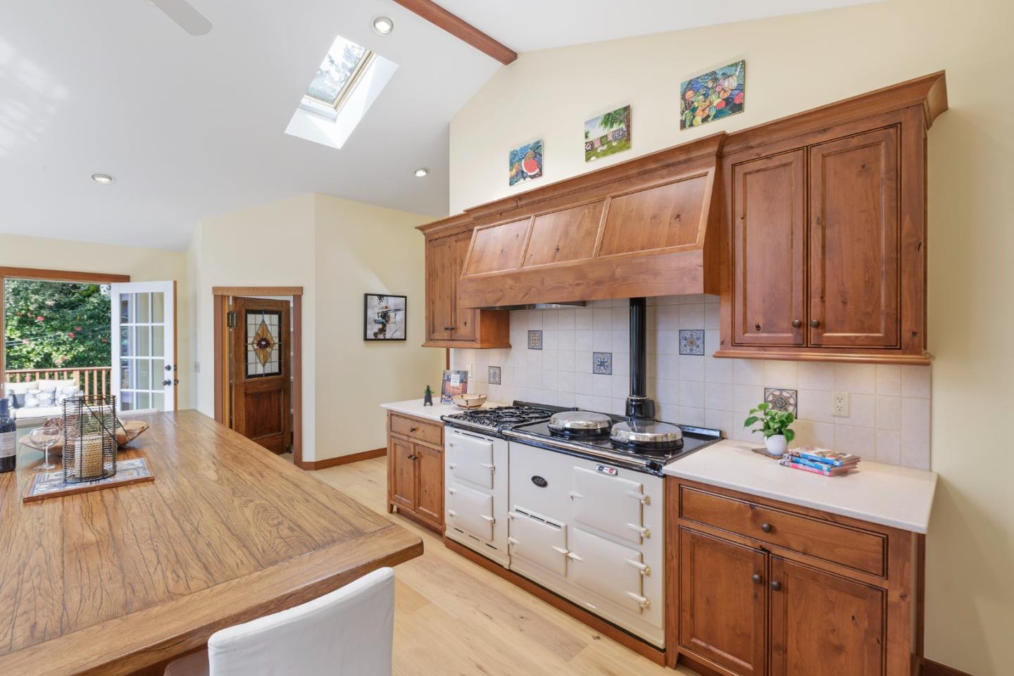 36 Skyline Drive Woodside, CA 94062 - Photo 23 of 67 a kitchen with stainless steel appliances granite countertop a stove a sink dishwasher and cabinets with wooden floor