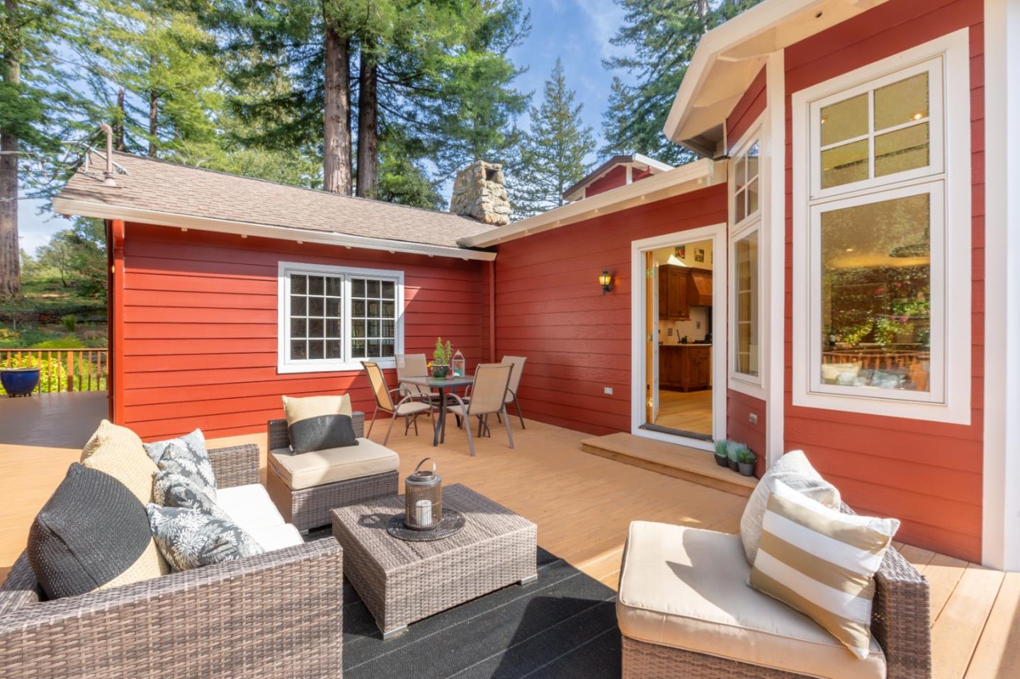 36 Skyline Drive Woodside, CA 94062 - Photo 29 of 67 a view of a patio with couches table and chairs and potted plants