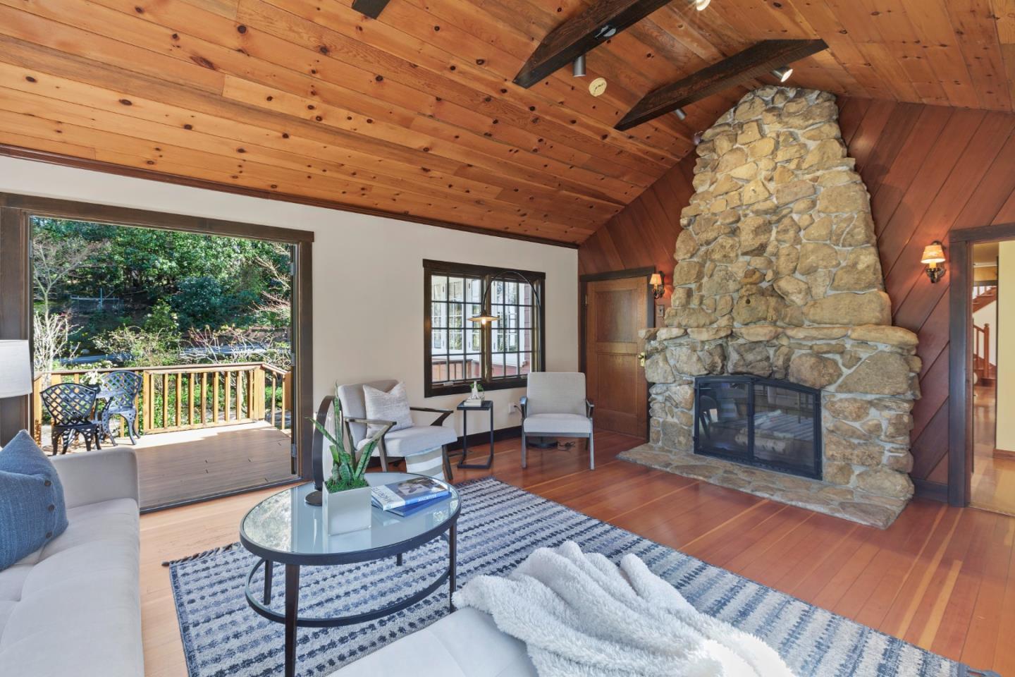 36 Skyline Drive Woodside, CA 94062 - Photo 34 of 67 a living room with furniture a fireplace and a table