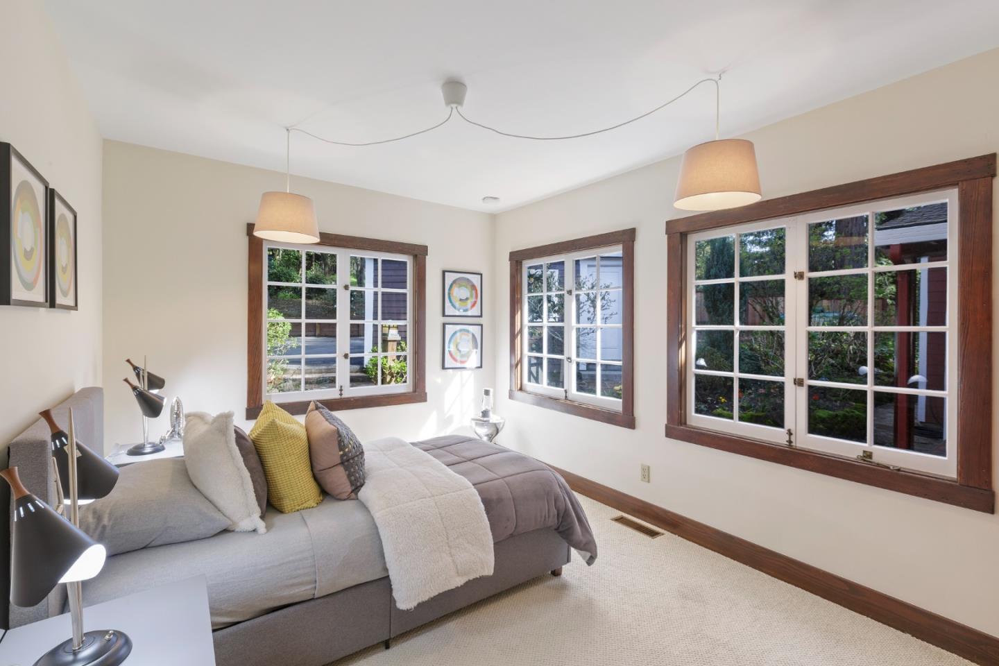 36 Skyline Drive Woodside, CA 94062 - Photo 38 of 67 a spacious bedroom with a bed and glass window