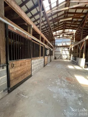 a view of an empty room with wooden walls