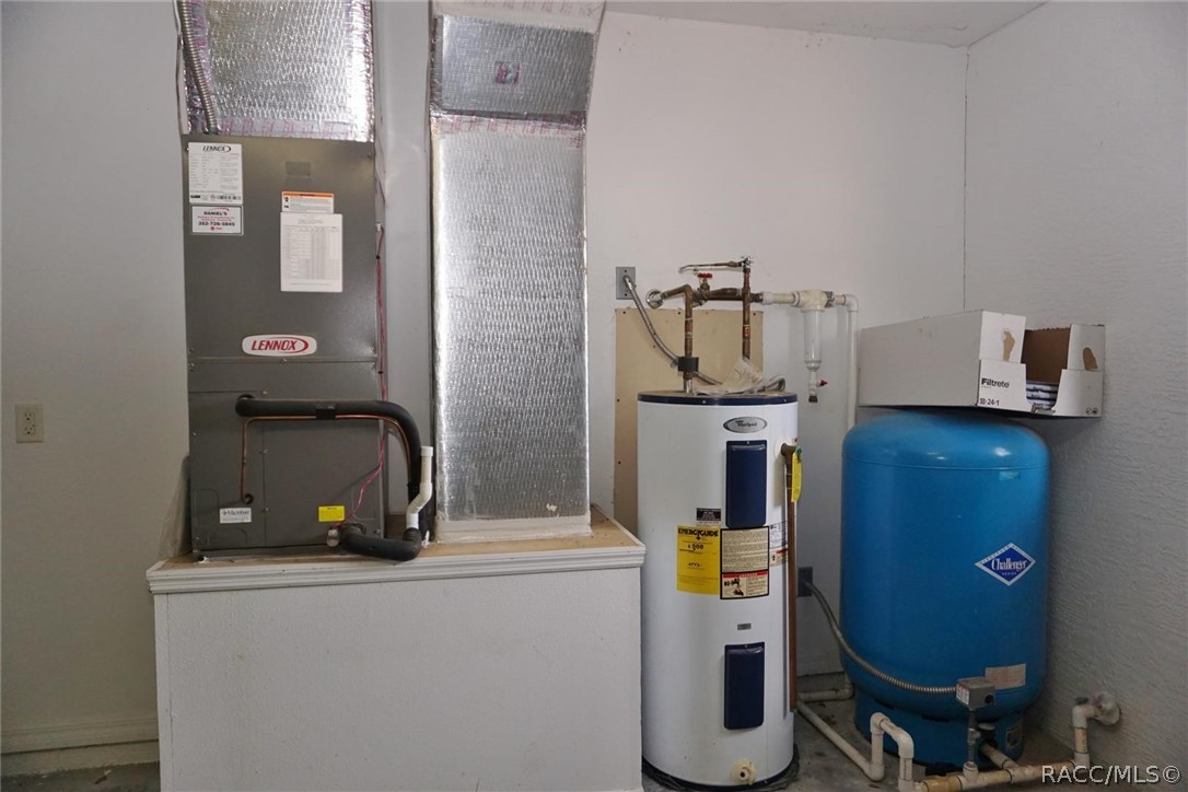 6079 East Penrose Street Inverness, FL 34452 - Photo 45 of 59 Hot water heater and well pressure tank