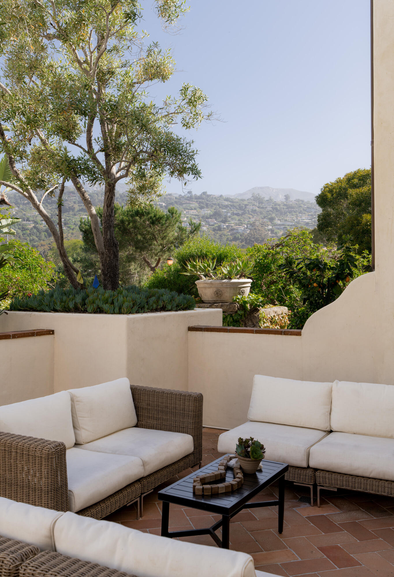 1011 Rinconada Road, Unit G Santa Barbara, CA 93101 - Photo 12 of 31 a view of a terrace with couches and a table