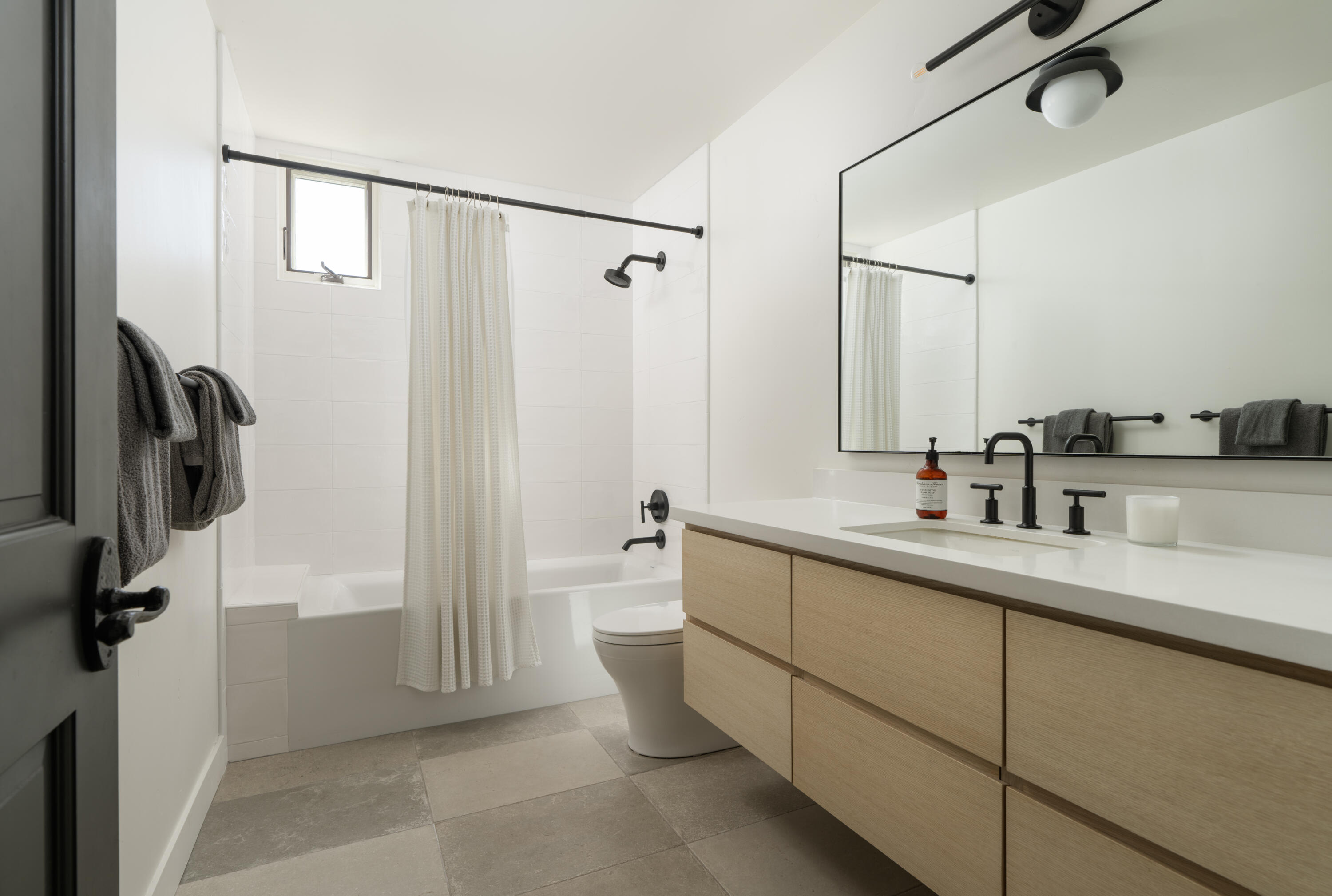 1011 Rinconada Road, Unit G Santa Barbara, CA 93101 - Photo 21 of 31 a bathroom with a double vanity sink toilet and shower