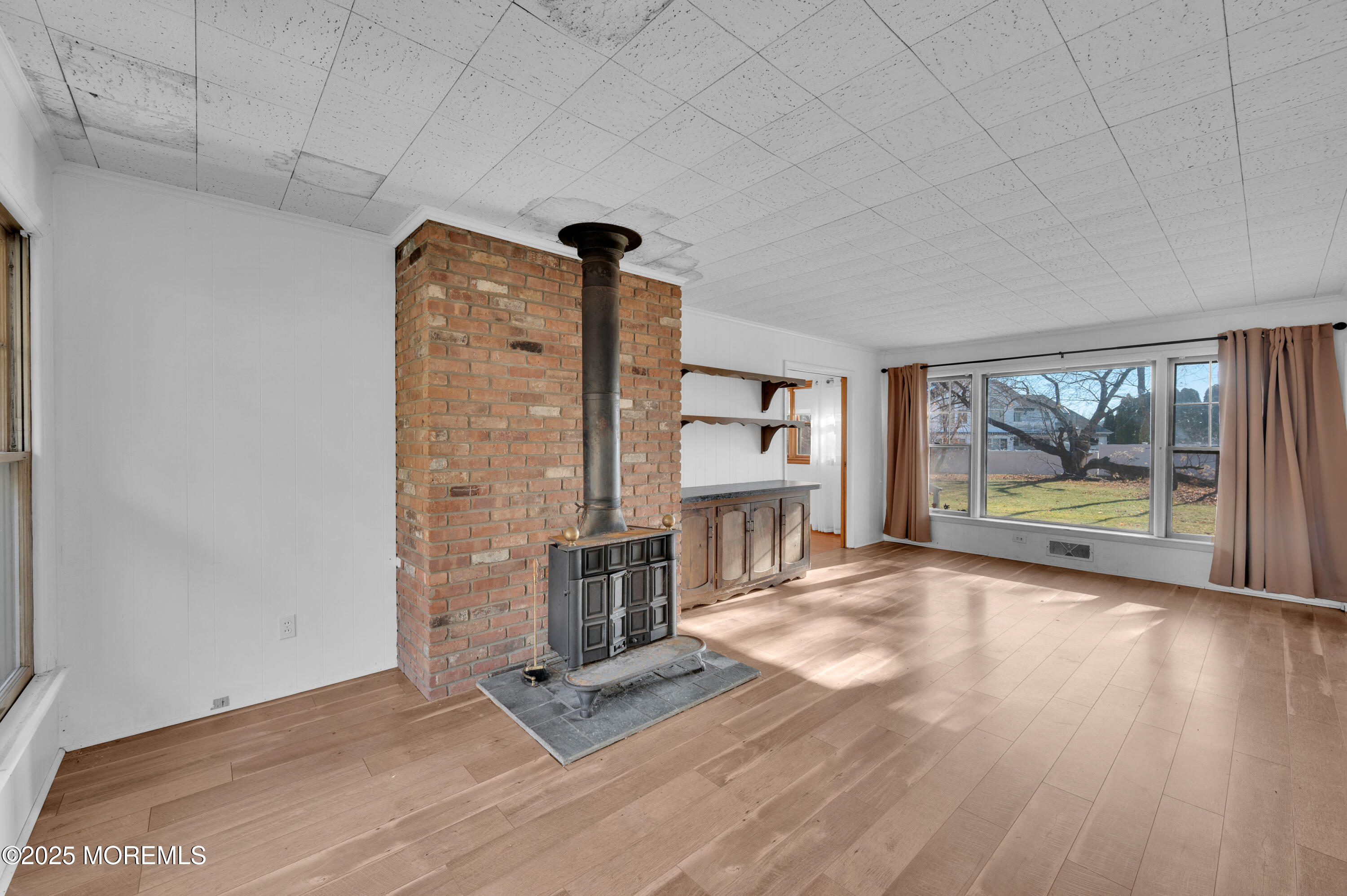 920 Ridge Road Brick, NJ 08724 - Photo 12 of 36 a view of an empty room with a window and wooden floor