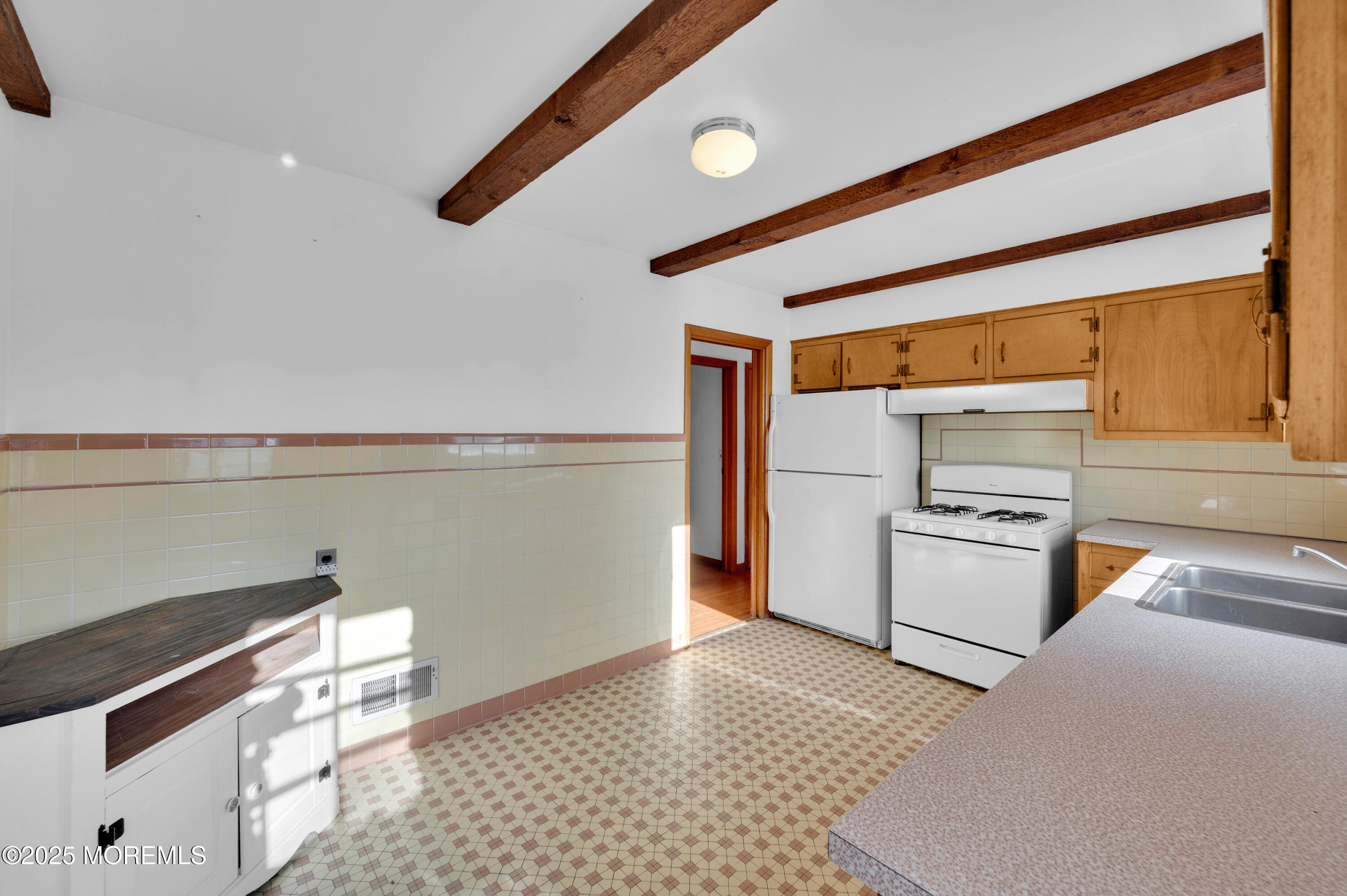 920 Ridge Road Brick, NJ 08724 - Photo 16 of 36 a kitchen with granite countertop white cabinets and white appliances