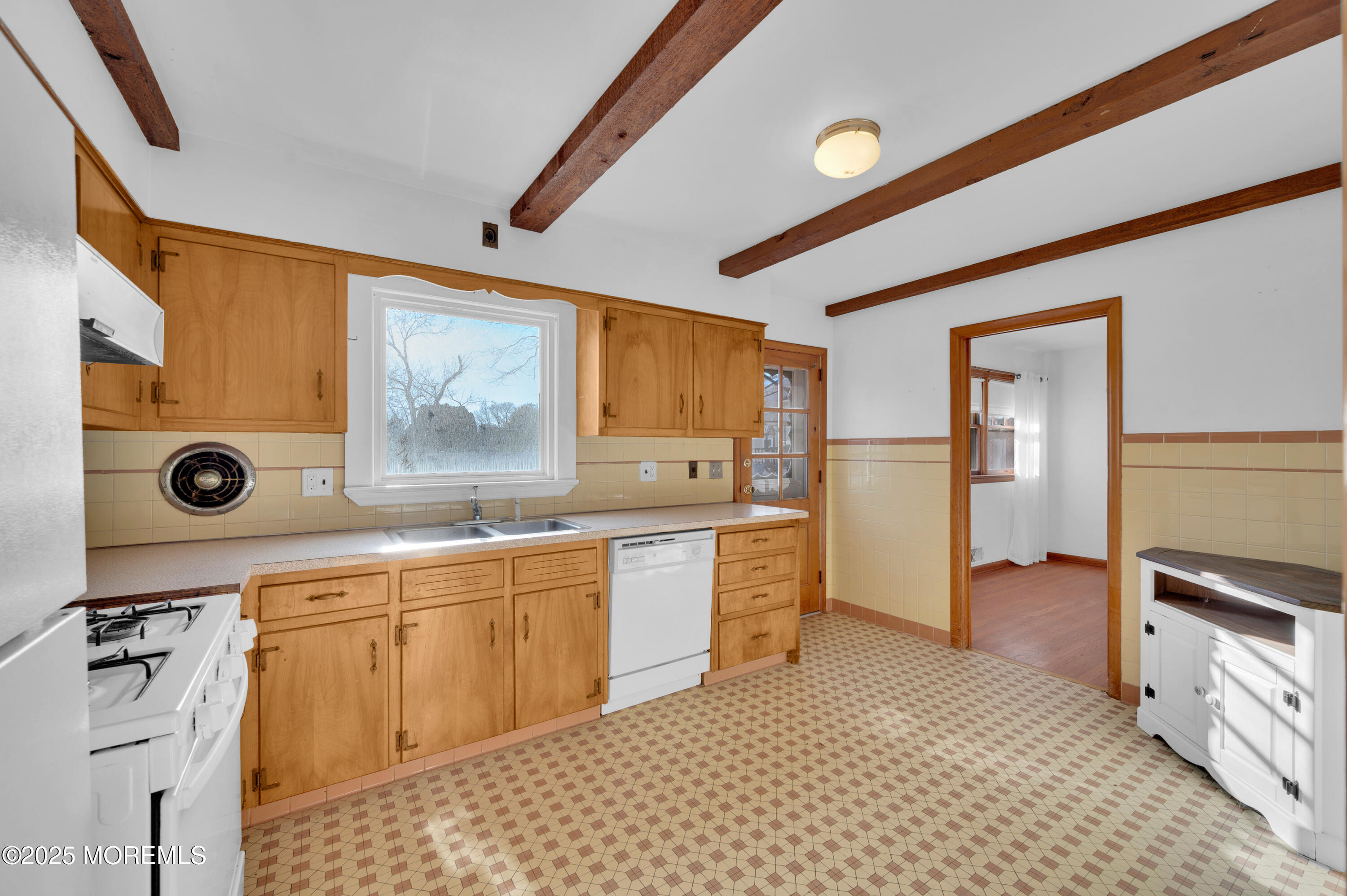 920 Ridge Road Brick, NJ 08724 - Photo 17 of 36 a large kitchen with stainless steel appliances granite countertop a sink and cabinets with wooden floor