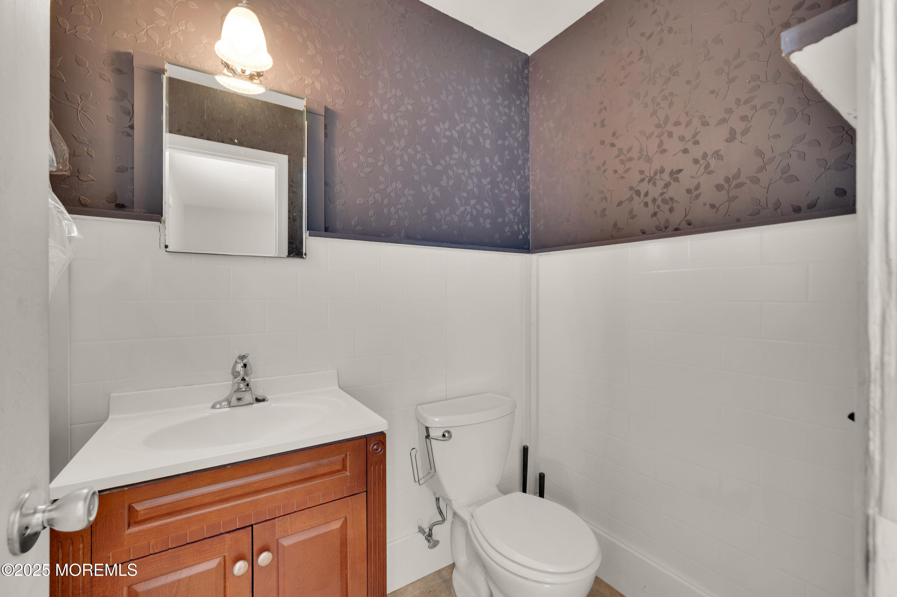 920 Ridge Road Brick, NJ 08724 - Photo 20 of 36 a bathroom with a toilet sink and mirror