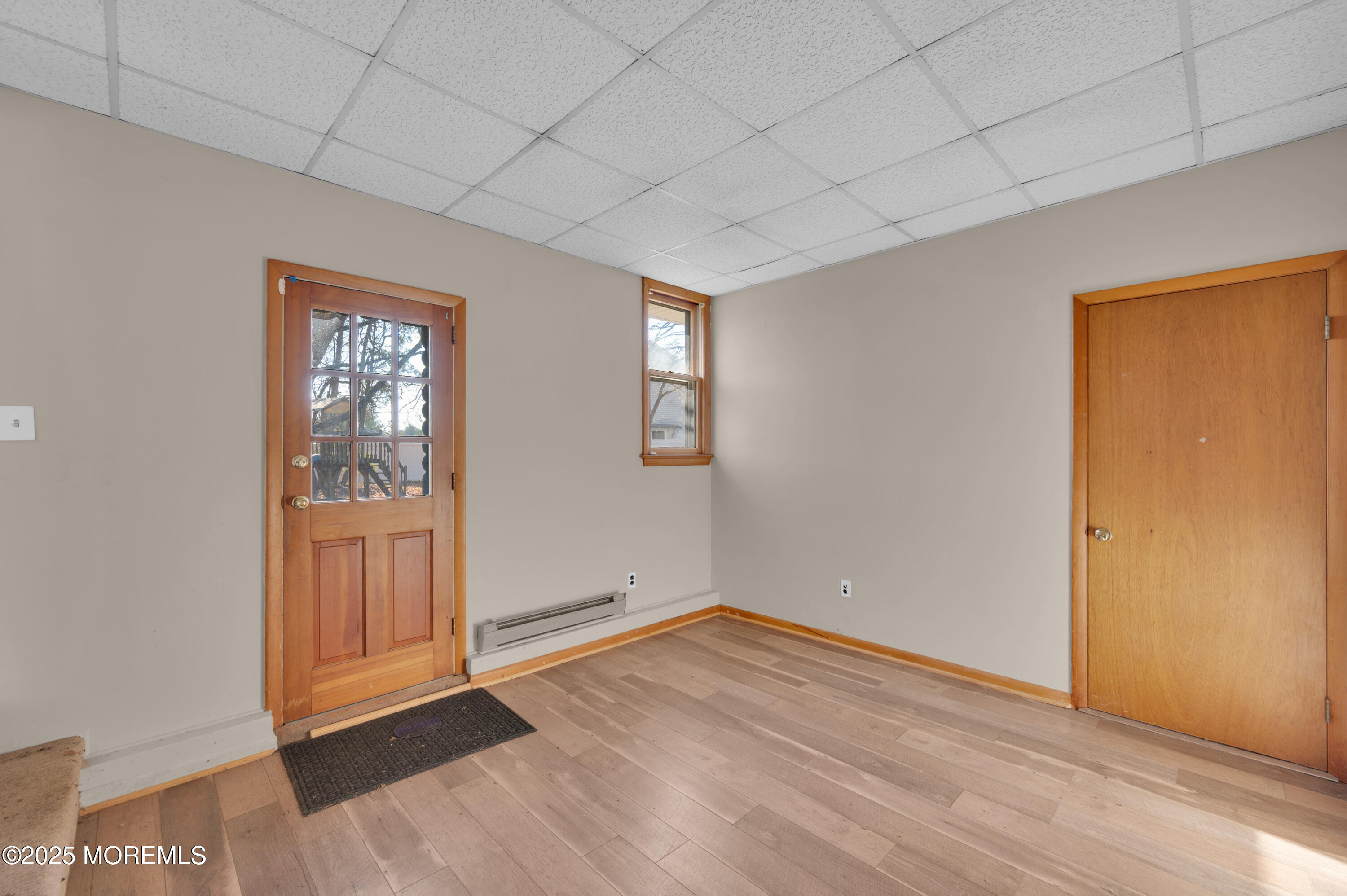 920 Ridge Road Brick, NJ 08724 - Photo 24 of 36 an empty room with wooden floor and windows