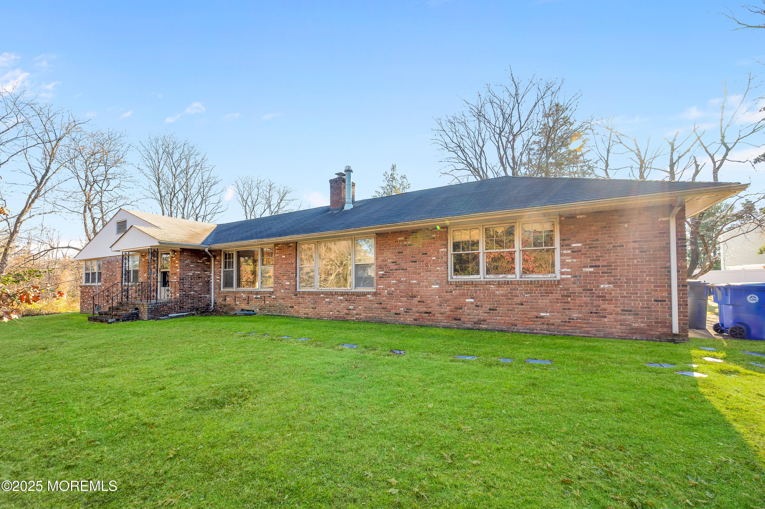 920 Ridge Road Brick, NJ 08724 - Photo 3 of 36 a front view of a house with a yard