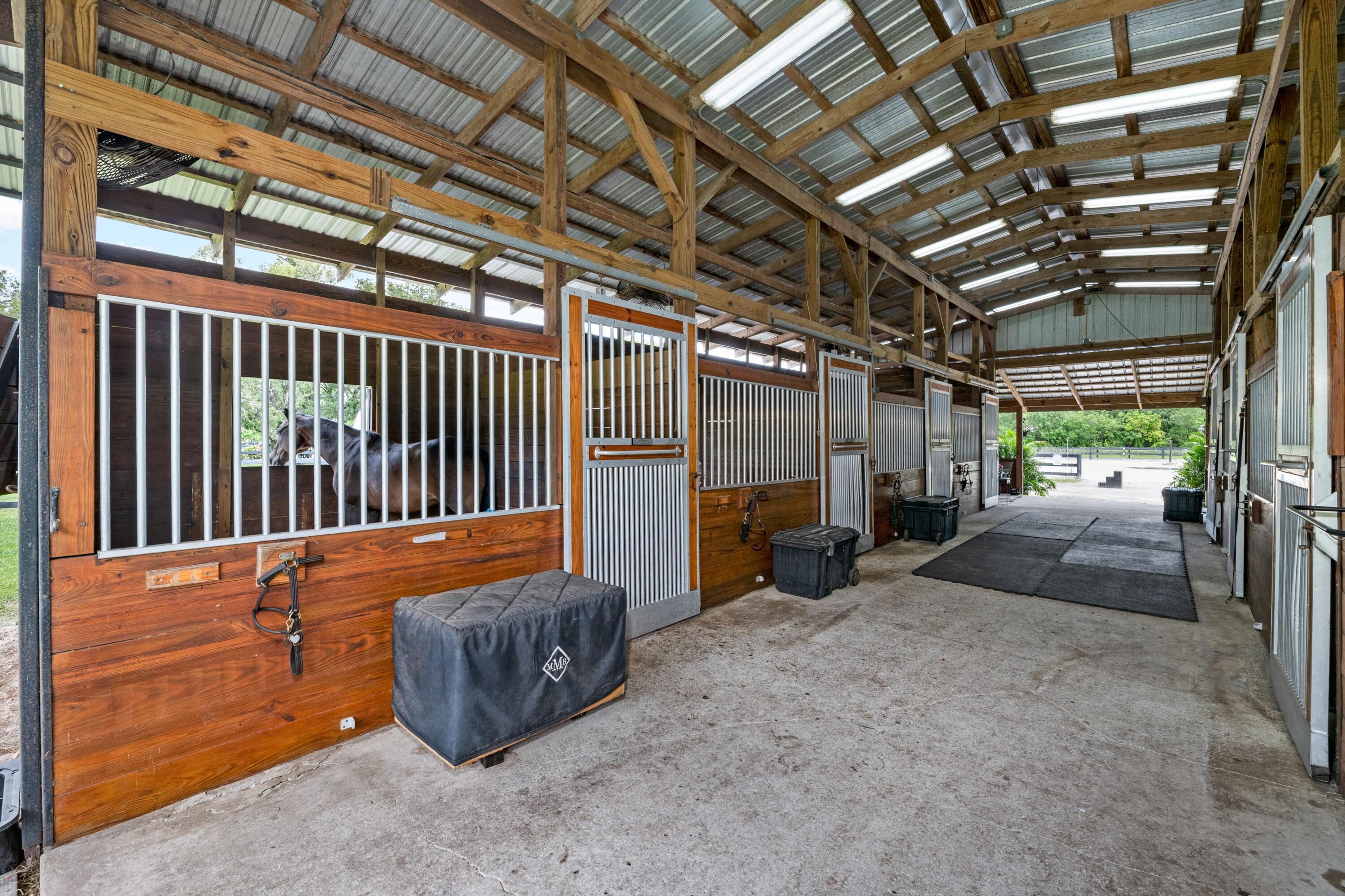 14536 N Road Loxahatchee Groves, FL 33470 - Photo 13 of 79 Center Aisle 7 Stall Barn