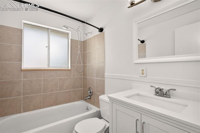 130 South Chelton Road Colorado Springs, CO 80910 - Photo 11 of 17 Full bath with vanity and shower/ tub on main floor.