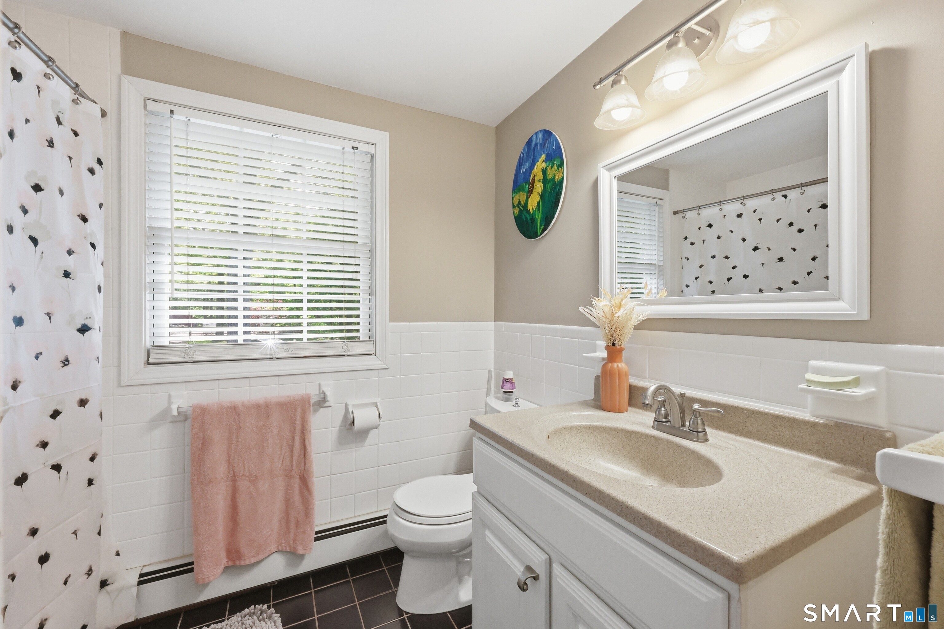 174 Canton Road Granby, CT 06035 - Photo 15 of 35 a bathroom with a sink a toilet and a window